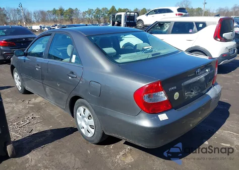 2003 Toyota Camry Le z USA, uszkodzony, nr VIN JTDBE32K930149280